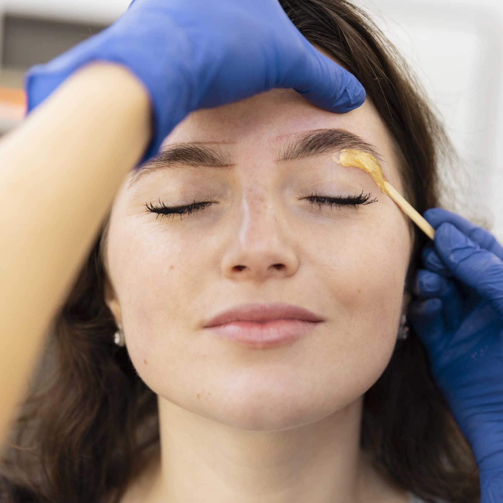 woman-getting-eyebrow-treatment-2